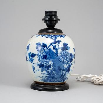 A blue and white jar made in to a lamp, China, early 20th Century.