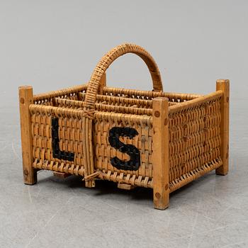 A rattan bottle basket.