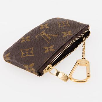 LOUIS VUITTON, Two 'Pochette Clés' key pouches, one in Monogram and the other one in Damier Ebene canvas.