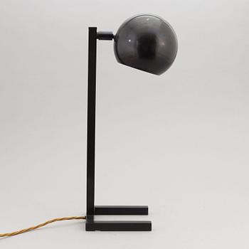 A contemporary table lamp.