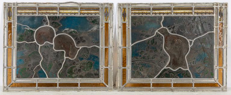 A pair of stained glass windows, circa 1900.