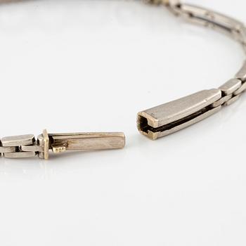 A bracelet in 14K white gold set with old-cut diamonds.