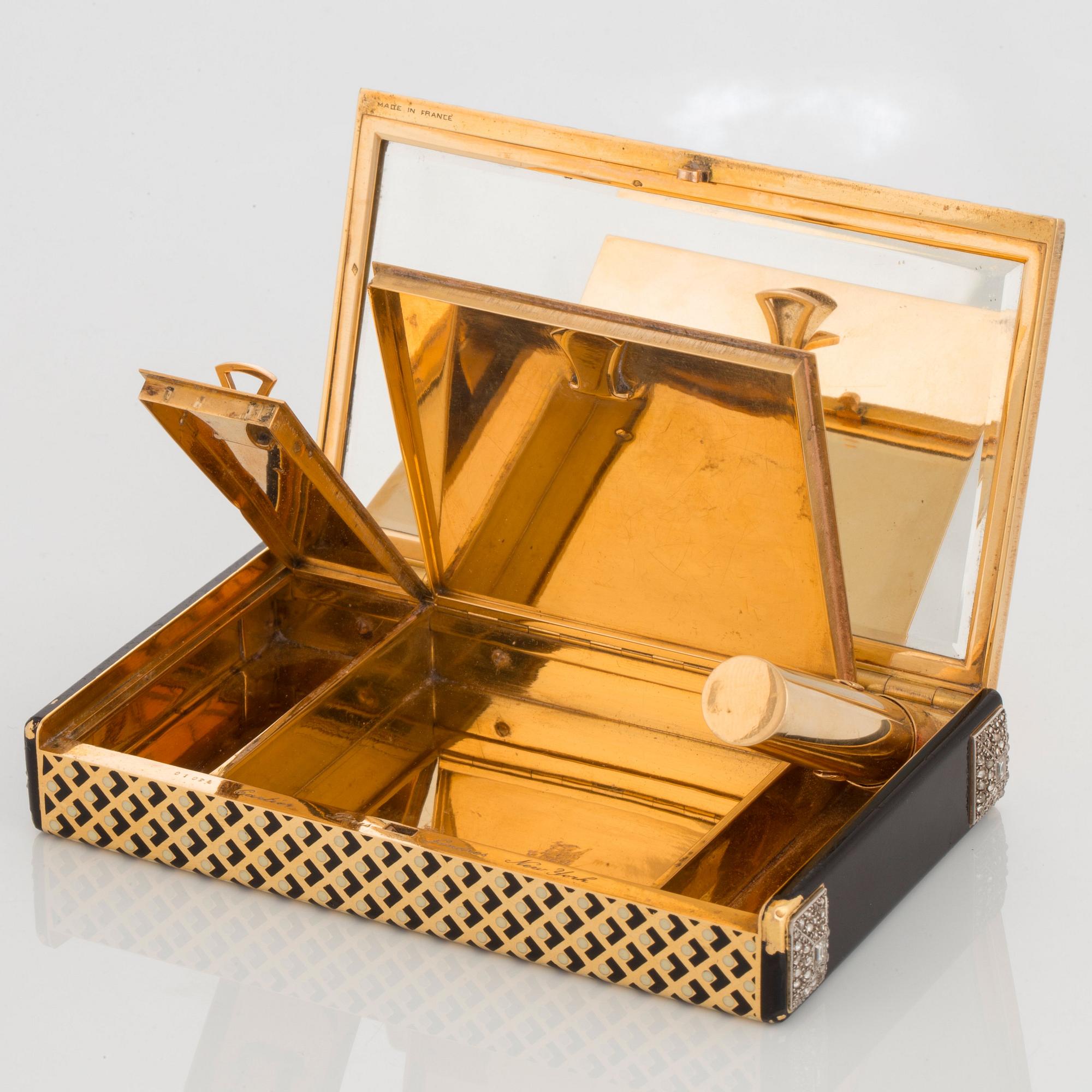 Cartier Art Deco Vanity Case 18K guld med svart emalj och baguette- och rosenslipade diamanter.