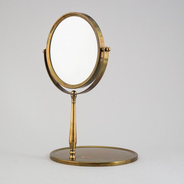 A mid 20th century brass and glass mirror.