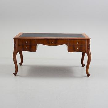 a mahogany rococo-style desk from the second half of the 19th century.