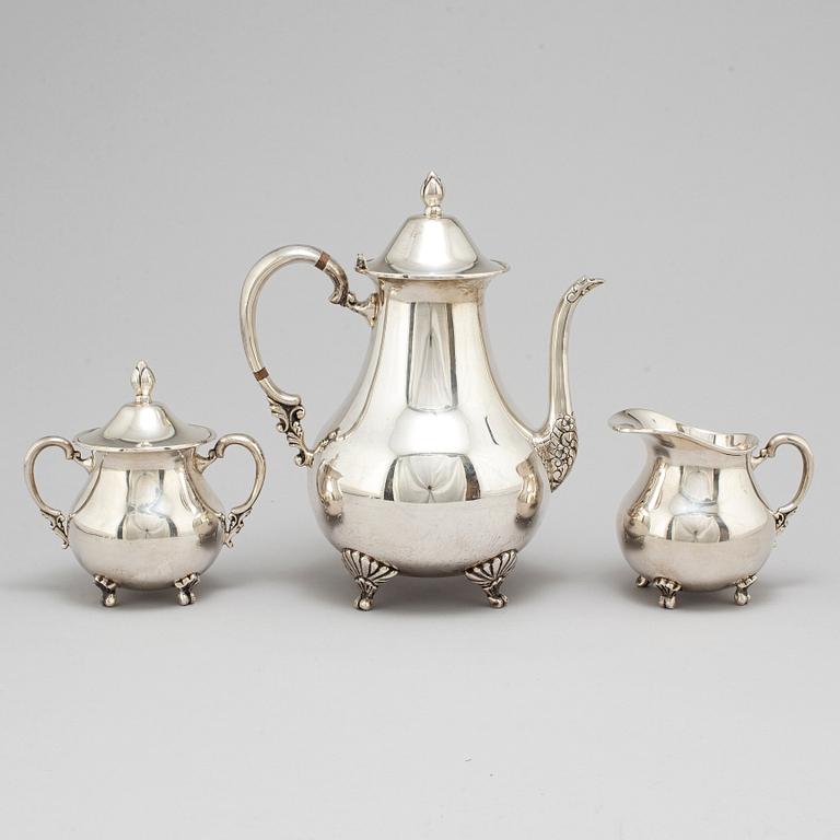 A sterling silver coffee pot, creamer and sugar bowl, 20th century.