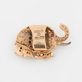 JARL SANDIN, Göteborg, 1993, ett spänne med rubin, safirer samt briljantslipade diamanter.