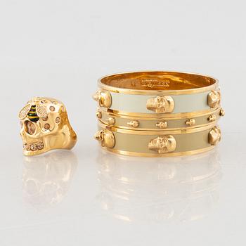 Alexander McQueen, three bracelets and a ring.