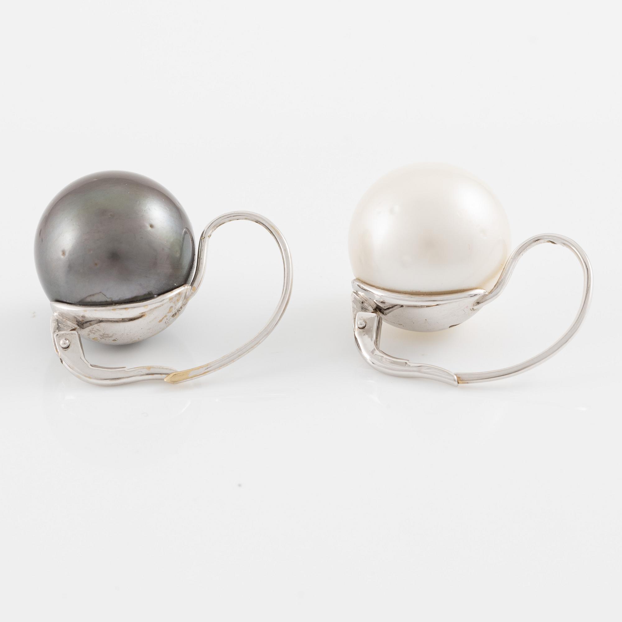Earrings with cultured Tahitian and South Sea pearls.