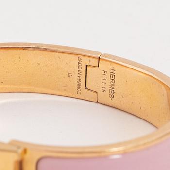 Hermès, a 'Clic H PM' bracelet.