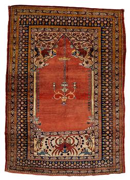 A rug, an antique silk Heriz, ca 166,5-170 cm x 116-120 cm.