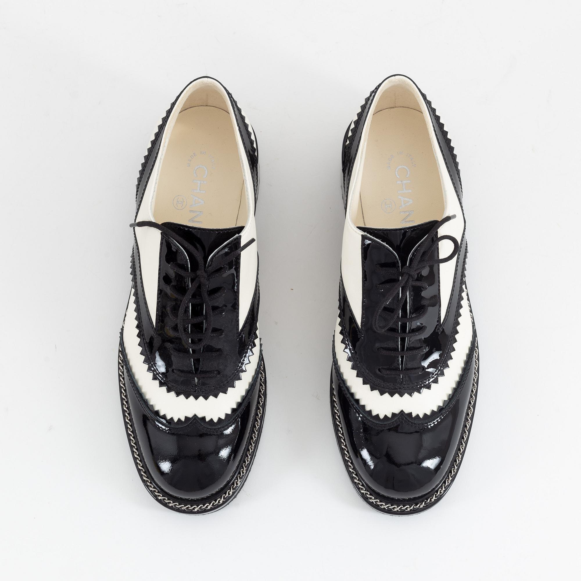Chanel, a pair of black and white leather brogues, size 39½.