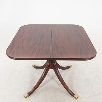 AN English mahogany dining table later part of the 20th century.