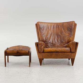 Illum Wikkelsø, a model V11 armchair and an ottoman by other maker, 1960's.