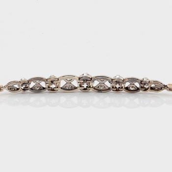 An 18K gold and platinum bracelet set with old- and eight-cut diamonds.