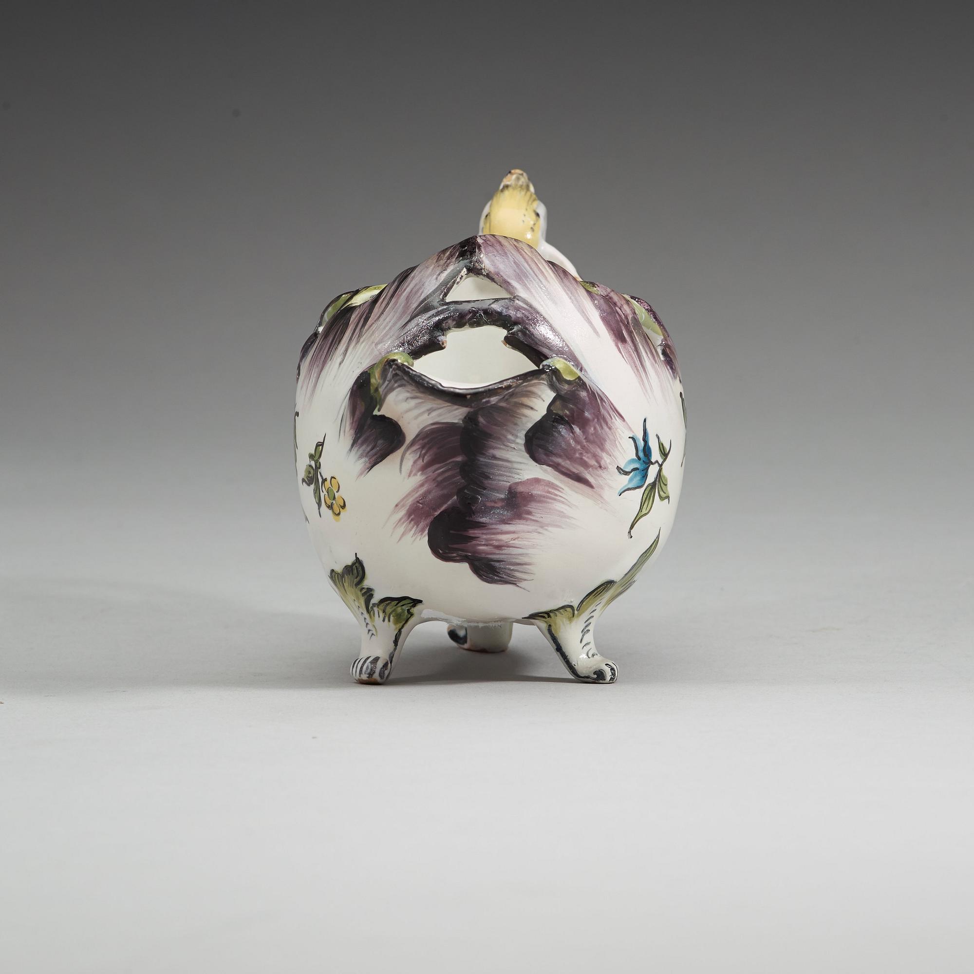 A Swedish faience sauce boat, Rörstrand, dated 25/11 (17)66.