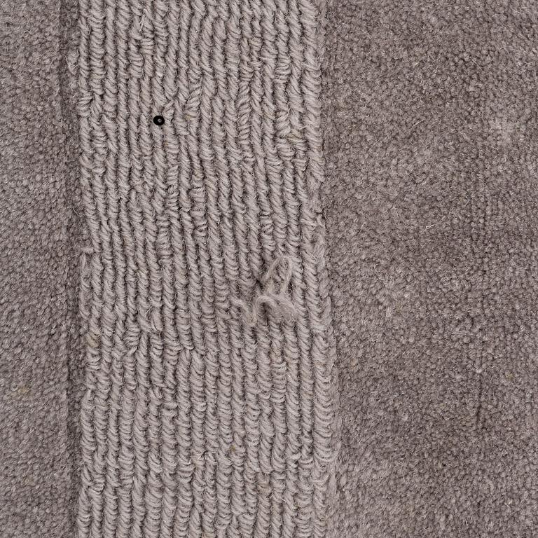 A Layered "Wool Cubes" carpet, 390x620 cm.