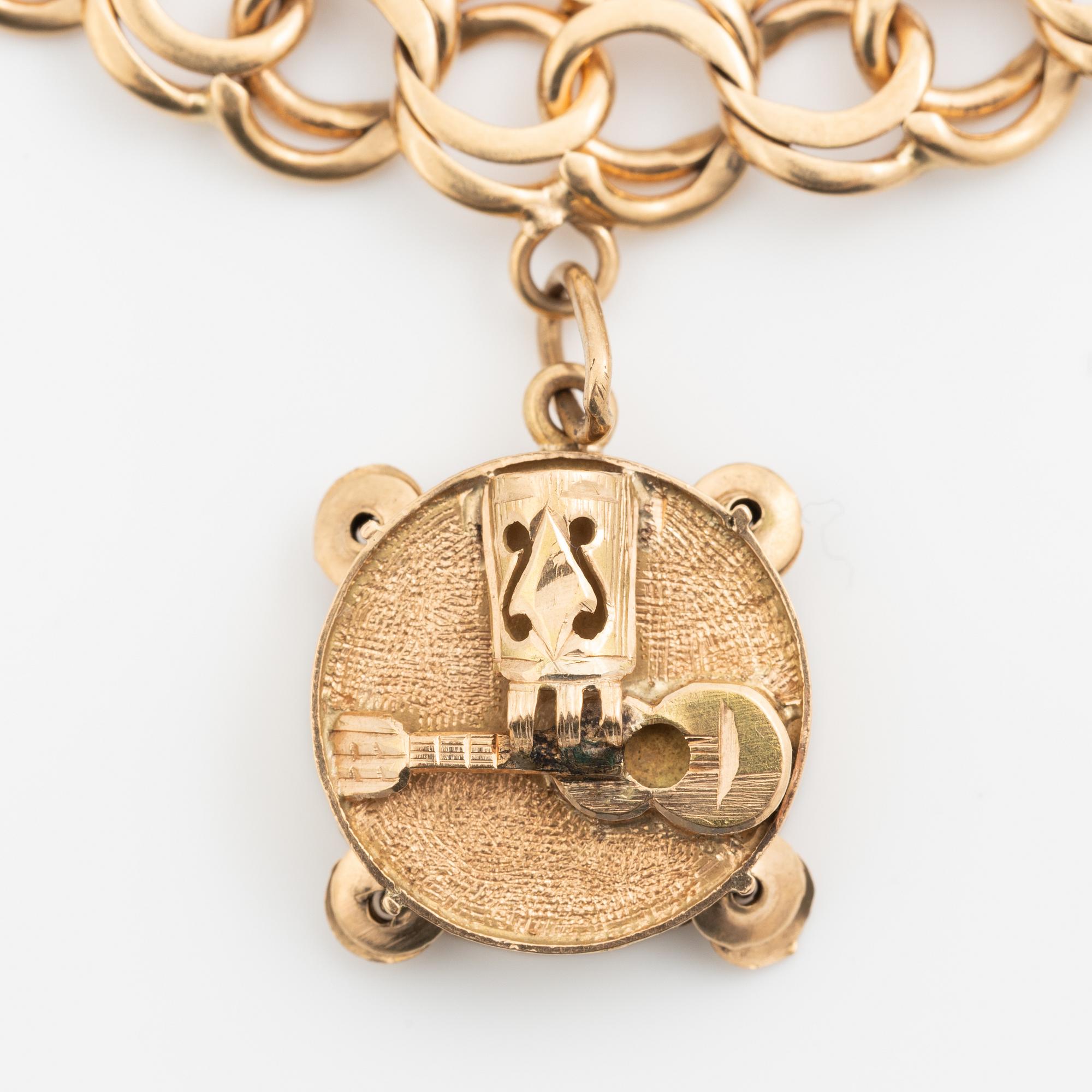 Armband 18K guld bismarcklänk, med berlocker.