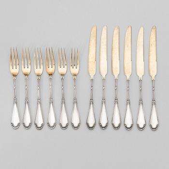 A set of Fabergé parcel-gilt silver dessert cutlery, 11 pieces + one fork later manufactured by Kultakeskus, Finland.