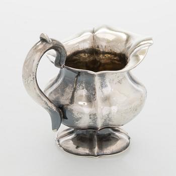 A silver cream jug, maker's mark of Michael Takkinen, St. Petersburg 1856.