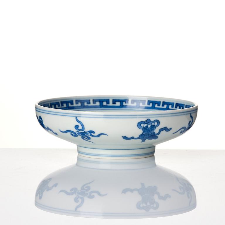 A blue and white heavily potted dish, Republic period with a mark.