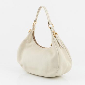 Prada, a white leather bag.