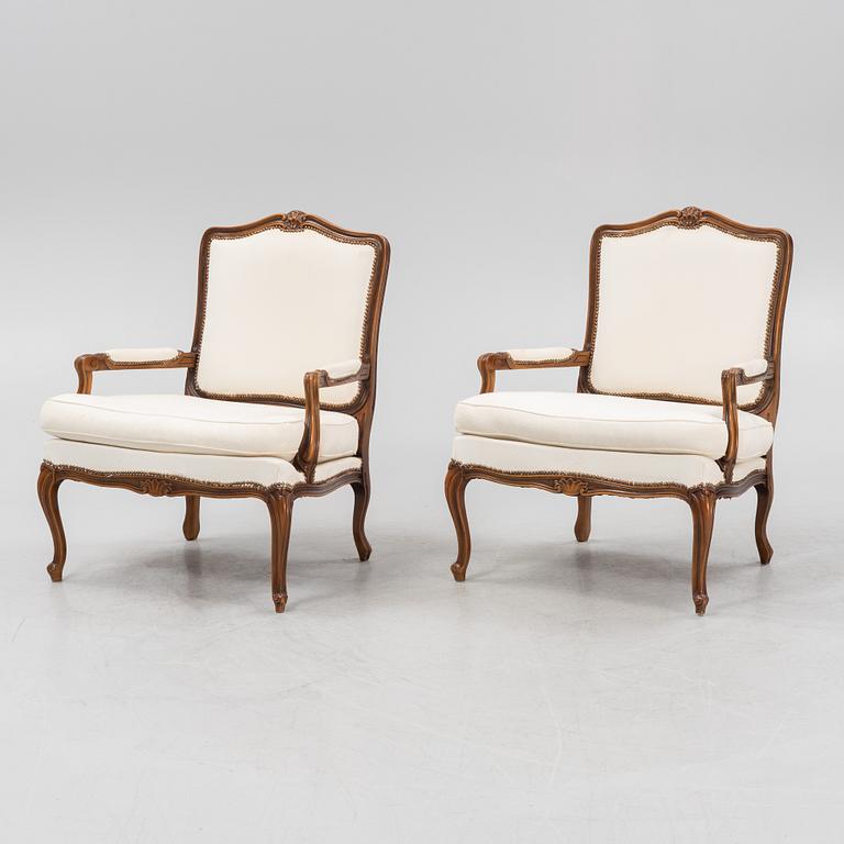 A pair of Rococo style armchairs, later part of the 20th century.