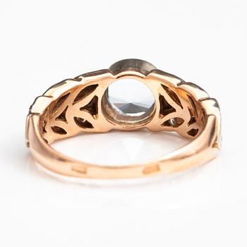 RING, 14K guld, diamanter ca 0.18 ct tot och topas.