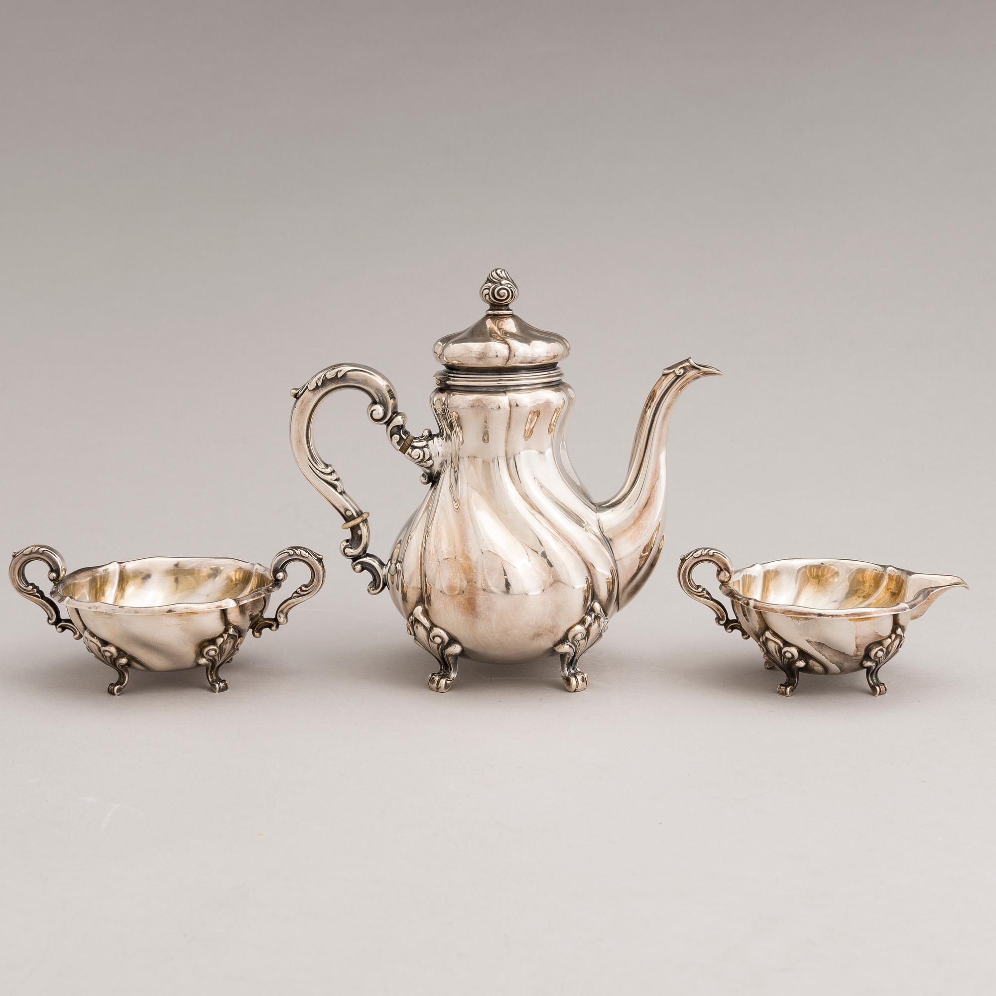 A silver sugar tong and a 3-piece silver coffee set, mark of Juho H. Pekuri, Oulu 1931 and Finnish import marks 1938.