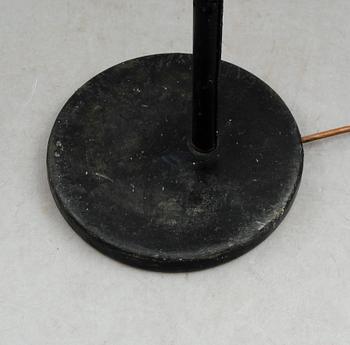 An Alvar Aalto 'A 808' brass and black leather floor lamp, Valaisinpaja, Finland late 1970's.