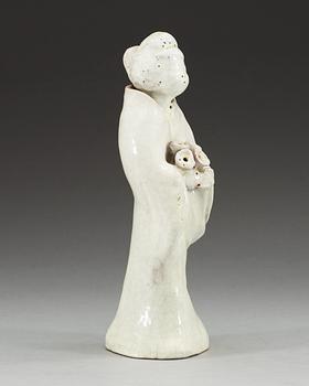 A white ge-glazed figure of a lady with flowers, presumably Japanese.