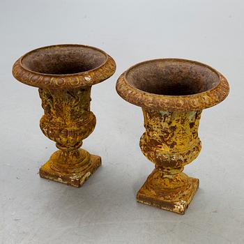 A pair of cast iron garden urns fist half of the 20th century.