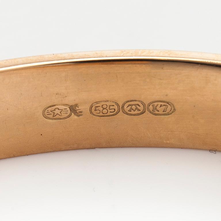 A 14K gold bracelet.