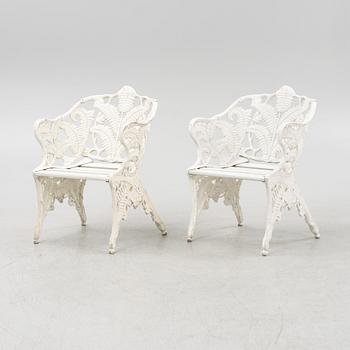 A pair of painted aluminum armchairs, second part of the 20th Century.