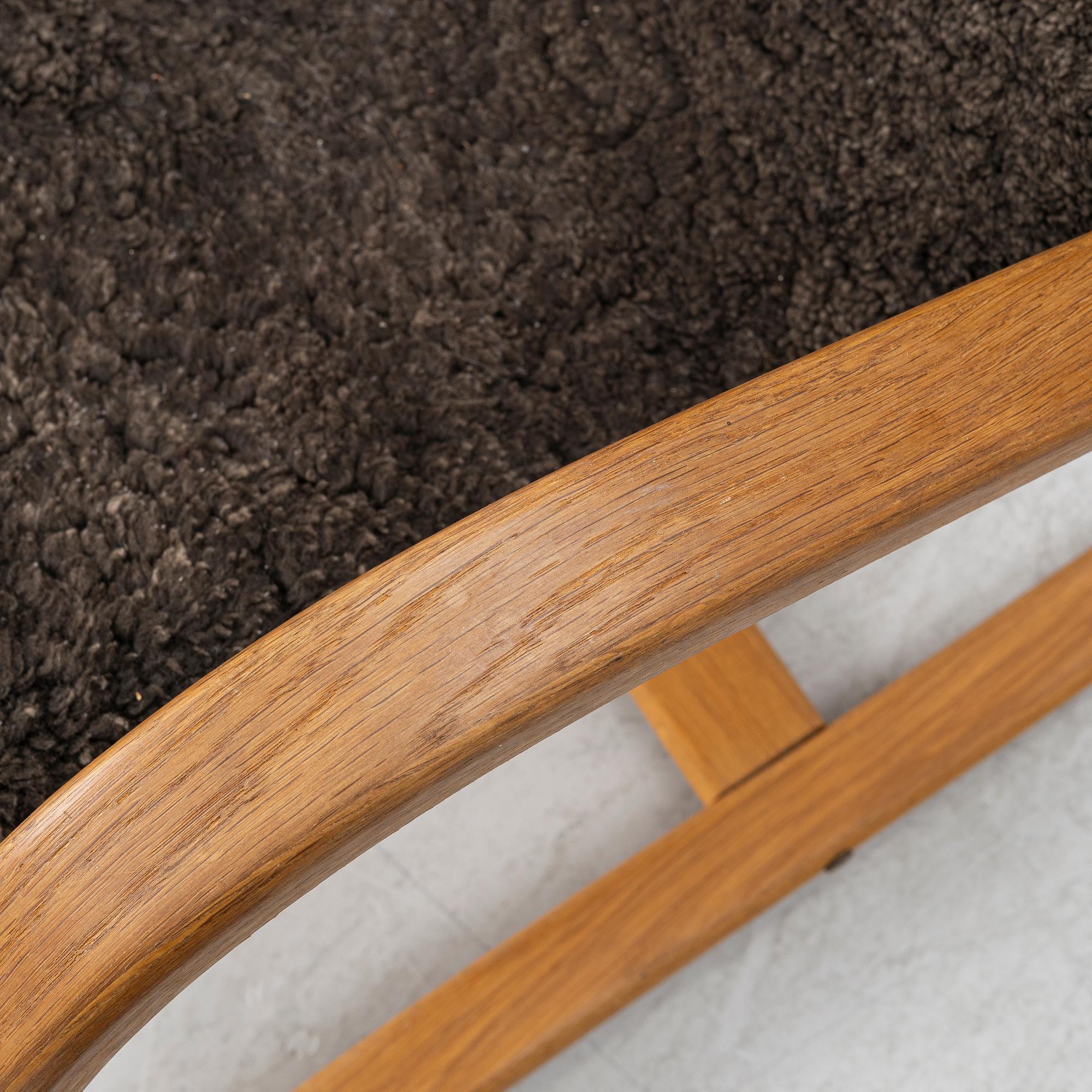 Jan Ekström, a "Gazell" armchair with a footstool, 21st century.