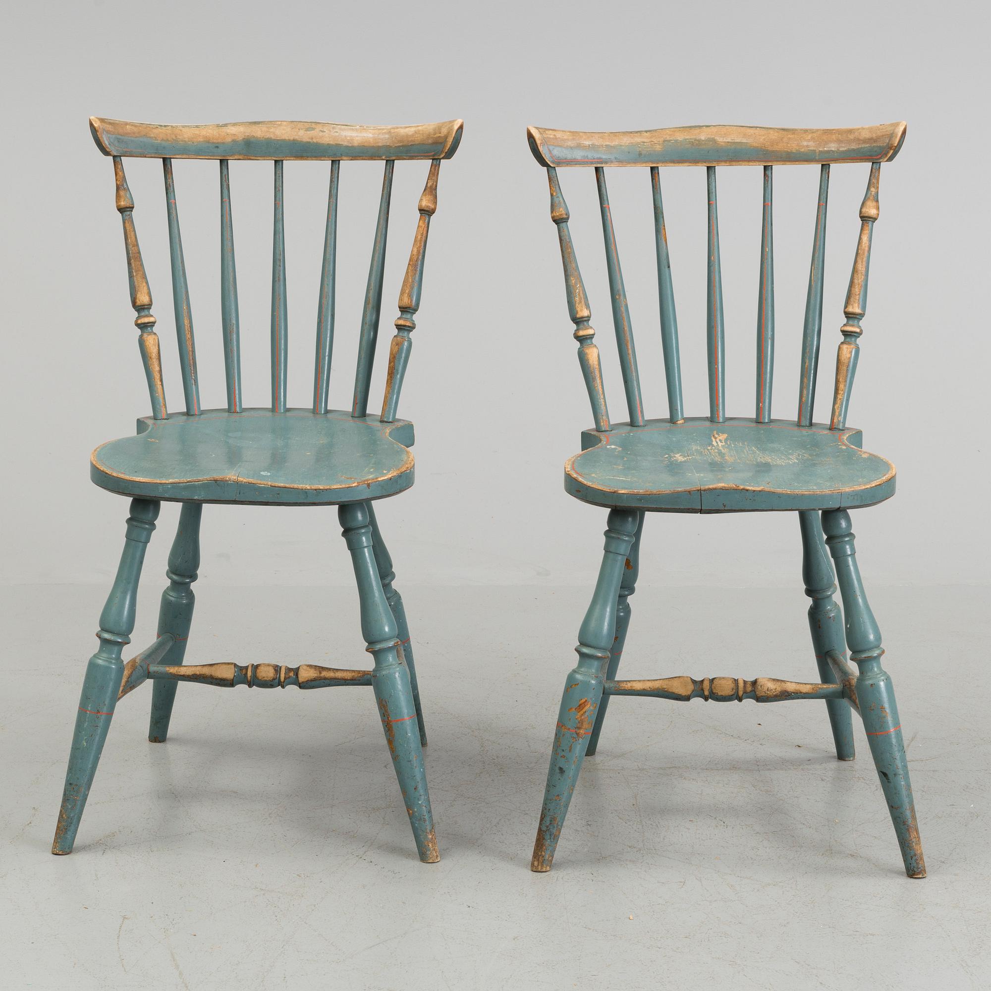 A pair of late 19th century painted chairs.