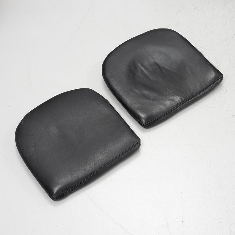 Chairs, a pair of leather, from the 1960s.