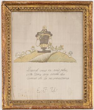 A 18th/19th century embroidery in an Gustaivan frame.