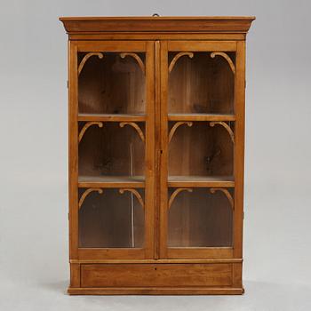 A mid 19th century hanging cabinet.