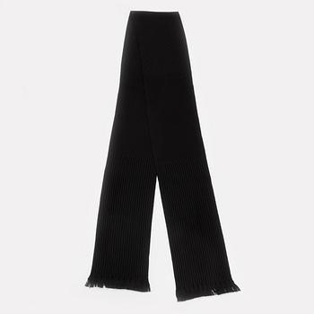 Gucci, a black wool scarf.