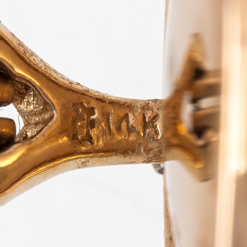 A pair of 14K gold and mabé pearl earrings.