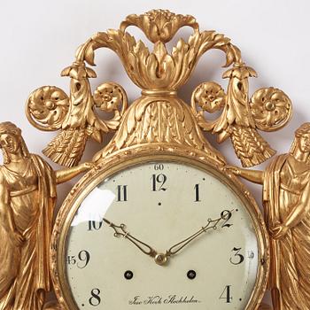 A late Gustavian giltwood cartel clock by J. Kock (royal watchmaker, active 1762-1803).