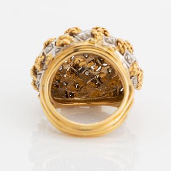 An 18K gold ring set with eight-cut diamonds.