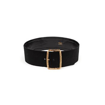 599. CHANEL, a black fabric and leather belt with gold colored buckle.