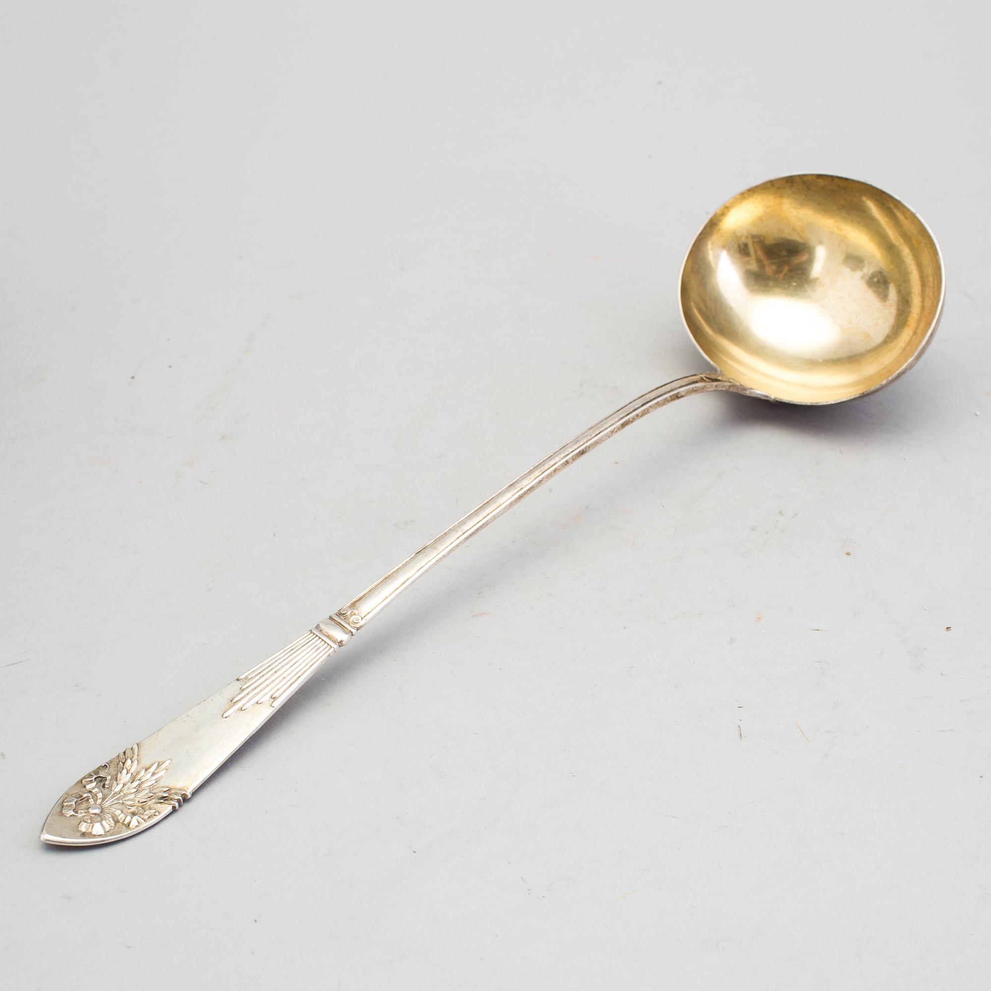 A Swedish early 20th century parcel-gilt soup-ladle, marked CGH, Stockholm 1907.