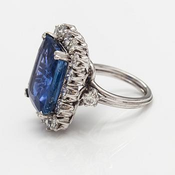 A platinum ring with a ca. 18.00 ct sapphire and ca. 3.00 cts of diamonds. With certificates.