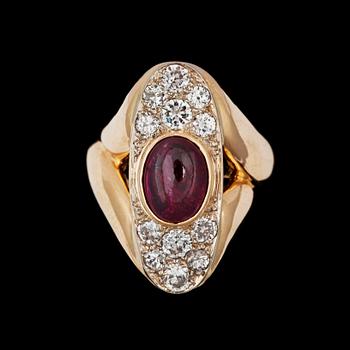 1154. A cabochon cut ruby and diamond tot. ca 1.4 ct, ring.