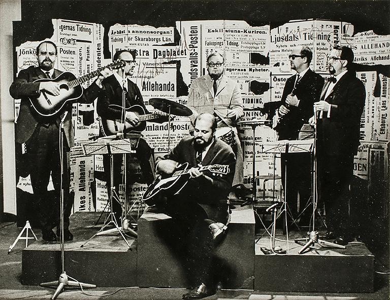 A SIGNED BLACK AND WHITE PHOTOGRAPH DEPICTING SWEDISH COMEDY GROUP "SKÄGGEN" CIRCA 1963.