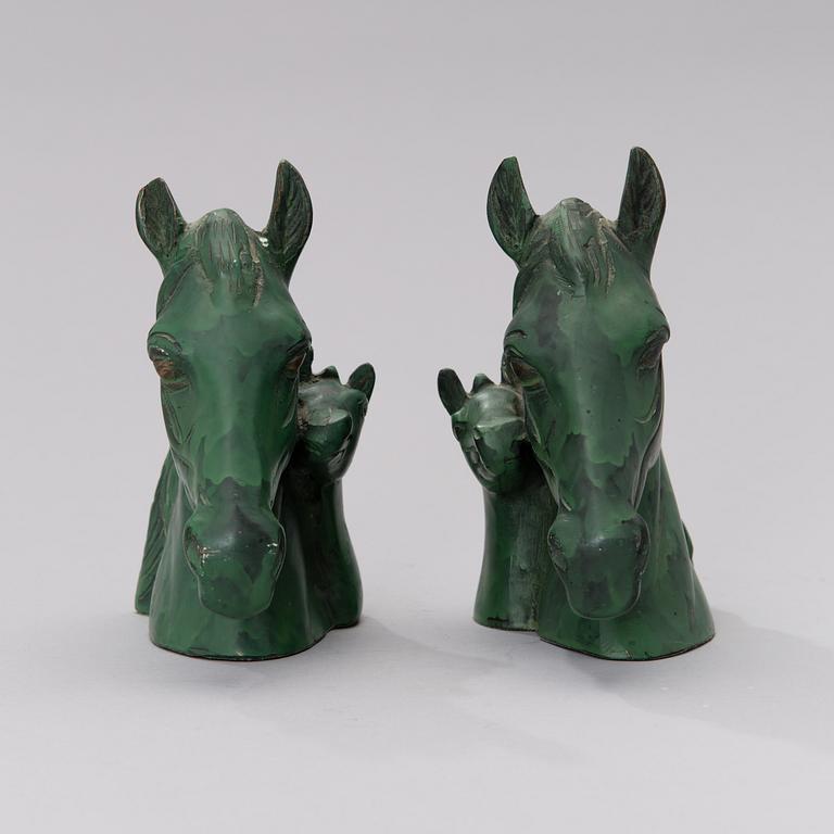 A pair of bronze bookends from the second half of the 20th century.