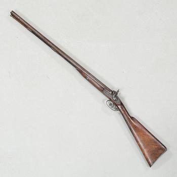A percussion rifle by Charles William Lanchester in London, around the mid 19th century.